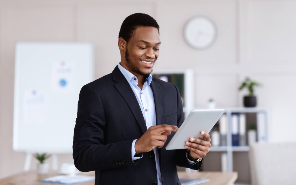 happy-african-american-businessman-using-digital-t-2022-10-07-01-08-35-utc.jpg