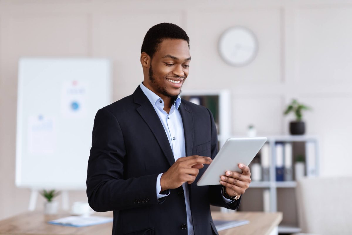 happy-african-american-businessman-using-digital-t-2022-10-07-01-08-35-utc.jpg